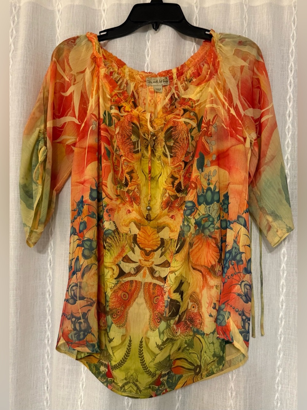 Live and Let Live women's sheer, vibrant orange, yellow floral & butterfly top.